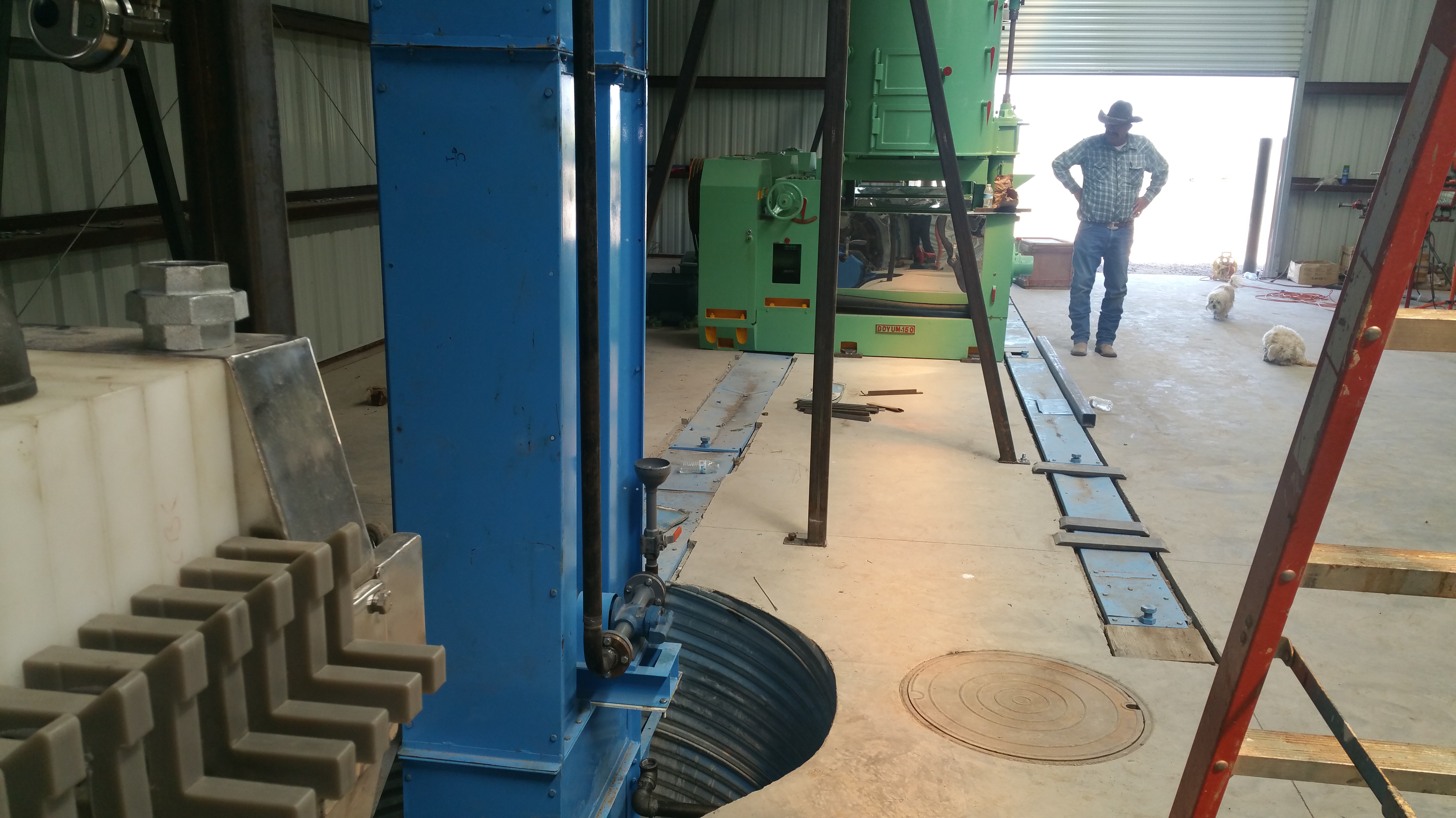 Showing machinery set down inside a concrete floor. Emphasizing that we have worked with customers on their unique foundation needs