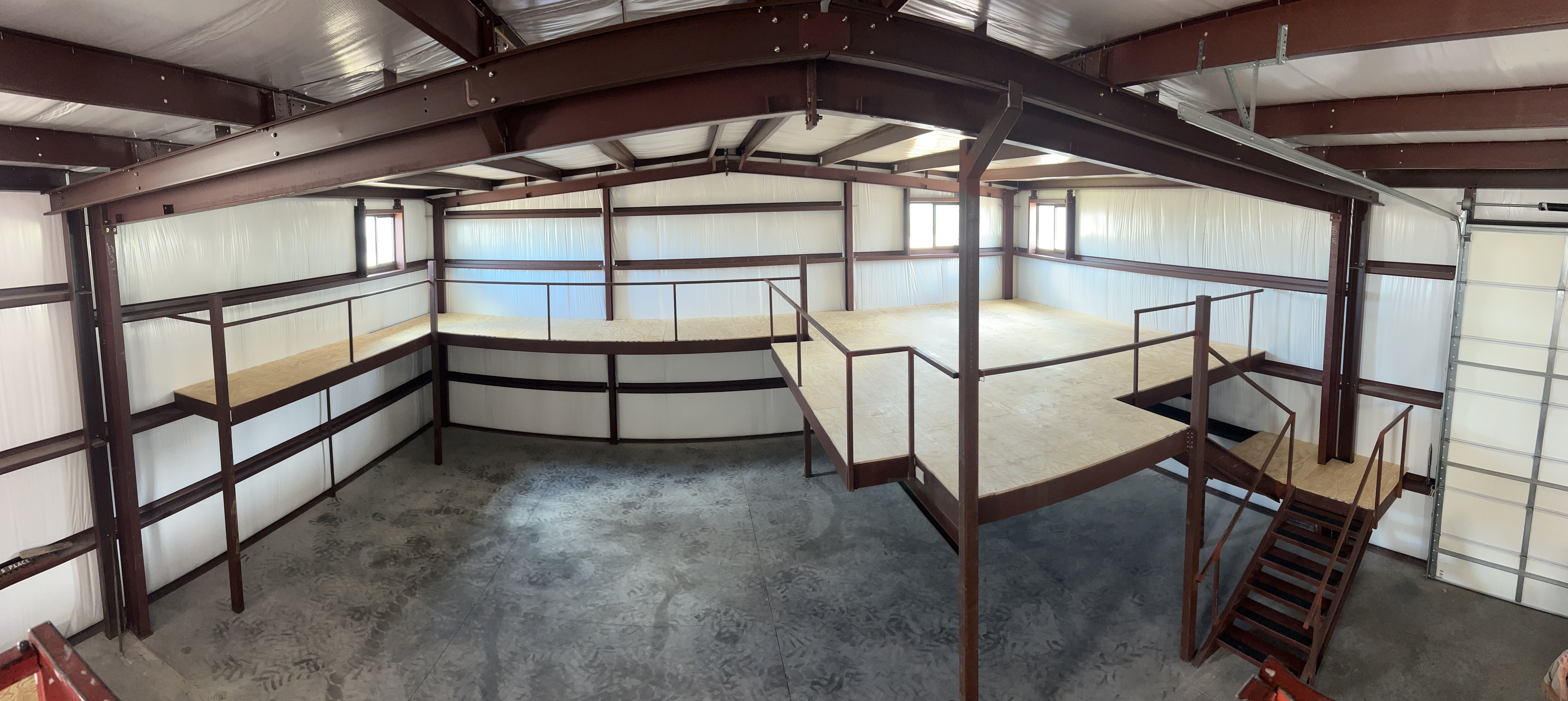 Showing a mezzanine with a complex floor-plan and stairs. Emphasizing our capacity to build mezzanines that fit our customers needs.